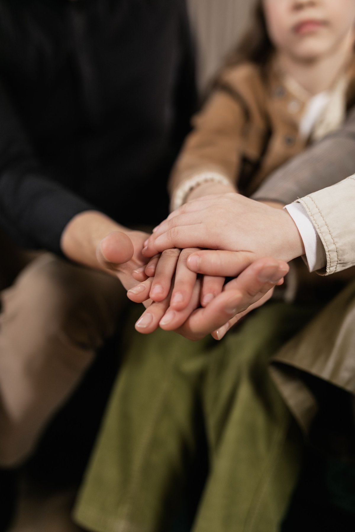 Family members holding hands together, finding common ground
